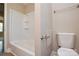 Bright bathroom with white tub, toilet, and towel rack at 571 Amity Se Ave, Concord, NC 28025