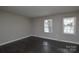 Comfortable bedroom with wood-look flooring and natural light at 571 Amity Se Ave, Concord, NC 28025