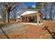 Carport area with brick pillars attached to house at 571 Amity Se Ave, Concord, NC 28025