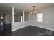 Dining room boasts a chandelier, and a bright window, and is connected to the other rooms at 571 Amity Se Ave, Concord, NC 28025