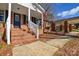 Inviting front porch with a classic door and decorative details at 571 Amity Se Ave, Concord, NC 28025