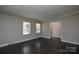 Bright living room with new floors and neutral color walls at 571 Amity Se Ave, Concord, NC 28025