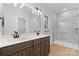 Modern bathroom featuring double vanity, tile shower, and bright lighting at 607 W Stanly St, Stanfield, NC 28163