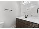 Modern bathroom boasts a sleek vanity with black hardware and a well-lit mirror at 607 W Stanly St, Stanfield, NC 28163