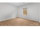 Bright bedroom featuring hardwood floors and a window letting in natural light at 607 W Stanly St, Stanfield, NC 28163