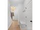 Bright foyer with staircase, coat hooks, bench, and elegant chandelier lighting at 607 W Stanly St, Stanfield, NC 28163