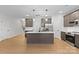 Spacious kitchen with stainless steel appliances, a central island, and sleek cabinetry at 607 W Stanly St, Stanfield, NC 28163