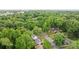 Birds-eye view of the property nestled among mature trees in a quiet residential neighborhood at 6126 Netherwood Dr, Charlotte, NC 28210