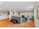 Spacious basement area offering hardwood floors, comfortable seating, and a modern kitchenette at 6126 Netherwood Dr, Charlotte, NC 28210