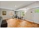 Spacious basement featuring hardwood floors, natural light, and ample room for activities at 6126 Netherwood Dr, Charlotte, NC 28210