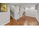 Nicely finished basement area featuring wood floors, stairs, and access to a bedroom at 6126 Netherwood Dr, Charlotte, NC 28210