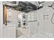 Beautiful bathroom with modern glass shower, double vanity, and convenient laundry area at 6126 Netherwood Dr, Charlotte, NC 28210