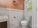Charming bathroom featuring neutral paint, modern fixtures, and an octagon shelf at 6126 Netherwood Dr, Charlotte, NC 28210