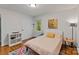 Cozy bedroom with hardwood floors, bright natural light, and a neutral palette at 6126 Netherwood Dr, Charlotte, NC 28210