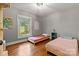 Bedroom featuring hardwood floors, a window view, and a serene atmosphere at 6126 Netherwood Dr, Charlotte, NC 28210