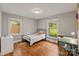 Bedroom with hardwood floors, with multiple windows to allow natural light at 6126 Netherwood Dr, Charlotte, NC 28210