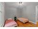 Bedroom featuring hardwood floors, a window view, and a serene atmosphere at 6126 Netherwood Dr, Charlotte, NC 28210