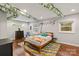 Charming bedroom decorated with creative string lights and a colorful rug at 6126 Netherwood Dr, Charlotte, NC 28210