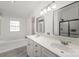 Bright bathroom featuring double sinks, a tub, and a separate shower at 620 Debruhl Rd, Chester, SC 29706