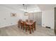 Bright dining area showcasing a wooden dining table set under a modern light fixture at 620 Debruhl Rd, Chester, SC 29706