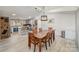 Open concept design with dining area flowing into the kitchen with an island and bar stool seating at 620 Debruhl Rd, Chester, SC 29706