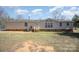 Exterior view featuring well-maintained siding, an inviting entryway, and a glimpse of the surrounding lawn at 620 Debruhl Rd, Chester, SC 29706