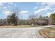 Charming ranch home featuring a long gravel driveway and inviting front porch at 620 Debruhl Rd, Chester, SC 29706