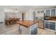 Stylish kitchen with island, stainless steel appliances, and an adjacent dining area at 620 Debruhl Rd, Chester, SC 29706