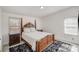 Cozy main bedroom with a four-poster bed, soft rug, and natural light from the windows at 620 Debruhl Rd, Chester, SC 29706