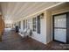 Relaxing covered porch with comfortable seating and stylish exterior details at 620 Debruhl Rd, Chester, SC 29706