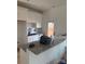 Modern kitchen with white cabinets, a black sink and granite countertops at 625 Academy St, Cleveland, NC 27013