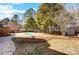 Spacious backyard featuring an in-ground pool, a storage shed and a wood perimeter fence at 631 Winding Branch Rd, Rock Hill, SC 29732