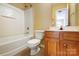 Standard bathroom featuring a shower-tub combo, toilet, and vanity with light wood cabinetry at 631 Winding Branch Rd, Rock Hill, SC 29732