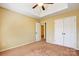 Bedroom featuring a ceiling fan, tray ceiling, carpet floors, and a closet at 631 Winding Branch Rd, Rock Hill, SC 29732