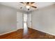 Bedroom with hardwood floors, neutral walls, and connecting rooms at 631 Winding Branch Rd, Rock Hill, SC 29732