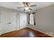 Bedroom with hardwood floors, neutral walls, and spacious closet at 631 Winding Branch Rd, Rock Hill, SC 29732