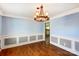 Dining room with hardwood floors, classic trim, and decorative chandelier at 631 Winding Branch Rd, Rock Hill, SC 29732