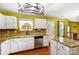 Bright kitchen with stone countertops, white cabinets, and stainless steel appliances at 631 Winding Branch Rd, Rock Hill, SC 29732