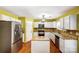 Modern kitchen featuring stainless steel appliances, an island, tile backsplash, and ample cabinet space at 631 Winding Branch Rd, Rock Hill, SC 29732