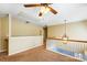 Loft area with tan walls, white railings, carpet floors, and chandelier lighting at 631 Winding Branch Rd, Rock Hill, SC 29732