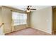 Carpeted loft area with a large window with sheer curtains and a ceiling fan with lights at 631 Winding Branch Rd, Rock Hill, SC 29732