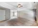 View of expansive carpeted main bedroom with a tray ceiling and ample natural light at 631 Winding Branch Rd, Rock Hill, SC 29732