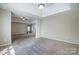 Large carpeted main bedroom showcases a tray ceiling and connects to adjacent spaces at 631 Winding Branch Rd, Rock Hill, SC 29732