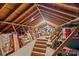 Large cluttered attic featuring exposed beams and stored boxes, offering potential storage or renovation at 710 Peranna Pl, Charlotte, NC 28211