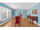 Bright dining room featuring hardwood floors, natural light, and neutral walls at 710 Peranna Pl, Charlotte, NC 28211