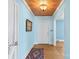 Open entryway with wood floors, neutral walls, and decorative ceiling fixture at 710 Peranna Pl, Charlotte, NC 28211