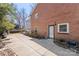 Brick house exterior with a concrete driveway and well-maintained landscaping, enhancing curb appeal at 710 Peranna Pl, Charlotte, NC 28211