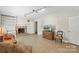 Cozy living room featuring a brick fireplace, neutral decor, built in bookshelf, and comfortable seating at 710 Peranna Pl, Charlotte, NC 28211