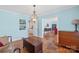 Spacious living room with wood floors, antique dresser, and neutral decor with ocean-themed artwork at 710 Peranna Pl, Charlotte, NC 28211