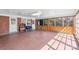 Bright sunroom with paneled walls, tile floor, and lots of natural light at 710 Peranna Pl, Charlotte, NC 28211